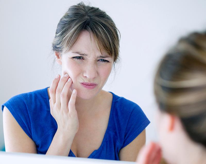 Patient experiencing facial pain