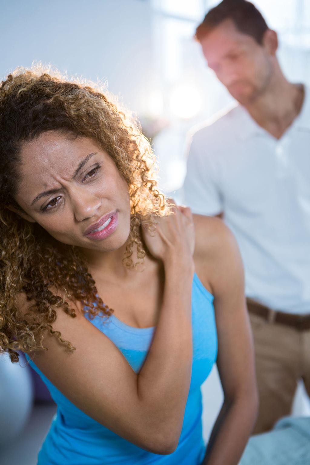 Patient experiencing neck tension and headache pain